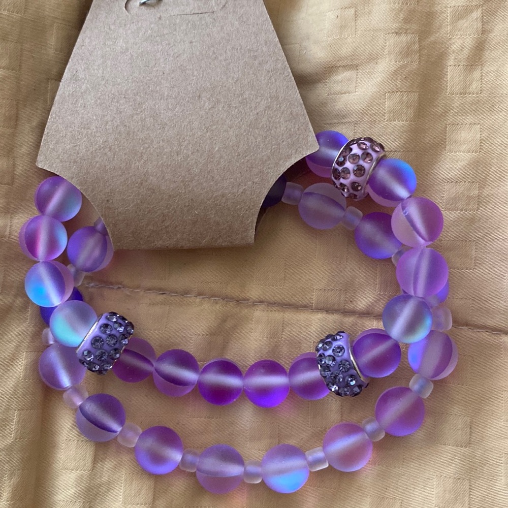 Set of 2illuminating glass beaded bracelets. Colors change as the light hits it.